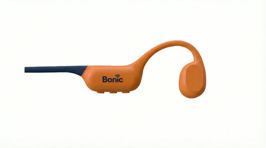 Orange Bonic wireless wearable device with black tip and ear hook on white background